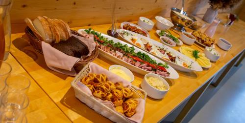 a buffet with many different types of food on a table at Kassari Puhkekeskus in Käina