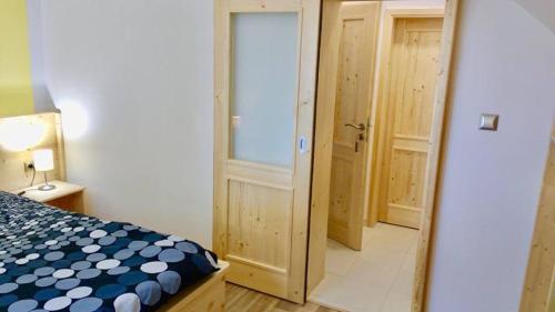 Cama ou camas em um quarto em Lipno Wave accommodations