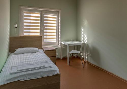 Säng eller sängar i ett rum på Miego namai