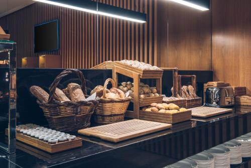 a display of bread and baskets on a counter at Iberostar Selection Lisboa in Lisbon