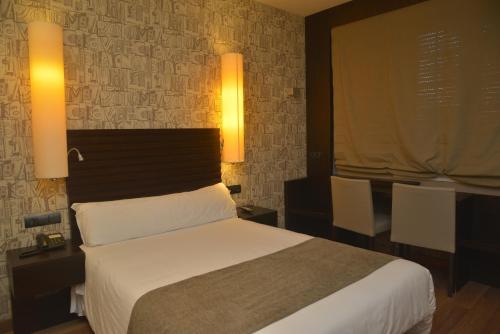 Postel nebo postele na pokoji v ubytování Hotel Gastronómico Casa Rosalia