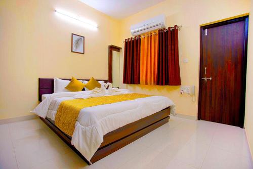 a bedroom with a large bed in a room at Daze Off Studio house in Bhuj