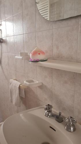 a bathroom with a sink and a mirror at Casa Clelia in Monsummano