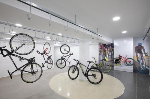 a group of bikes on display in a room at Prestige Victoria in Roses