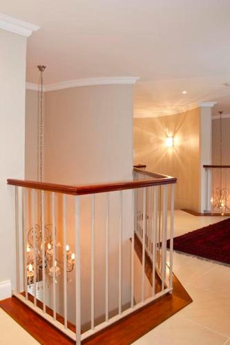 a room with a staircase in a house at Forest Manor Boutique Guesthouse in Durban