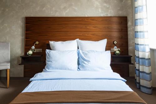 Ένα ή περισσότερα κρεβάτια σε δωμάτιο στο AKZENT Hotel Laupheimer Hof