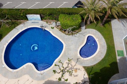 an overhead view of two swimming pools in a yard at Prestige Victoria in Roses