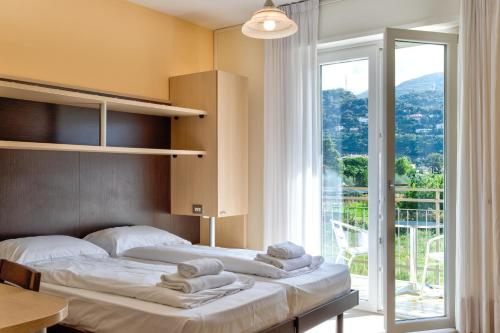 Postel nebo postele na pokoji v ubytování Hotel Roma