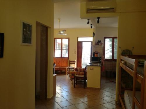 a room with a kitchen and a living room at Calabrian Home in Casa Roccani