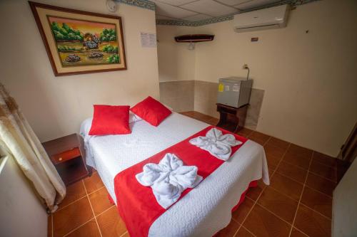 Postel nebo postele na pokoji v ubytování Hostal Gladismar