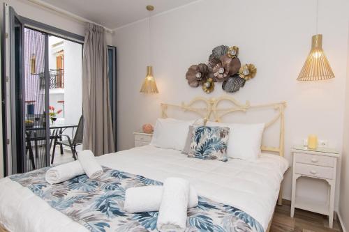 Ένα ή περισσότερα κρεβάτια σε δωμάτιο στο Naxos Enjoy Apartments