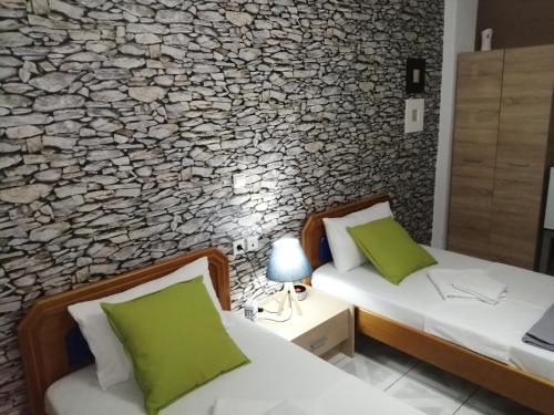 A bed or beds in a room at Hotel Efyra