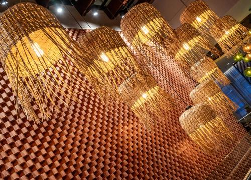 a bunch of gold chandeliers hanging from a ceiling at Hyatt Place Bogota Convention Center in Bogotá