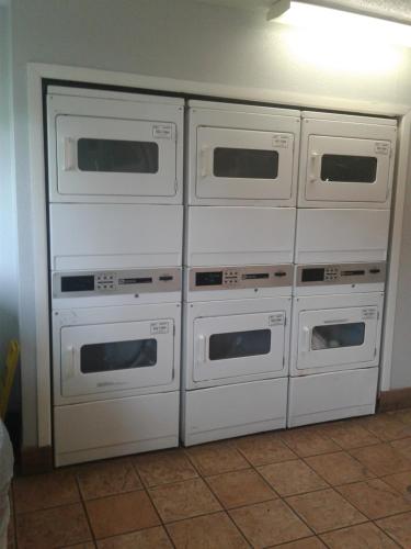 four ovens stacked on top of each other in a kitchen at InTown Suites Extended Stay San Antonio TX - Perrin Beitel Road in San Antonio