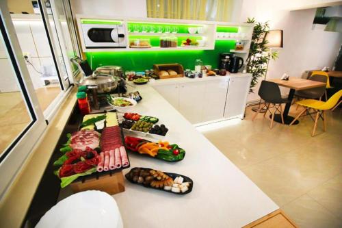 a kitchen with a counter with food on it at Casa Boca in Cluj-Napoca