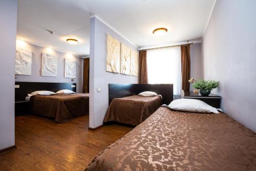 Posteľ alebo postele v izbe v ubytovaní Primo Hotel