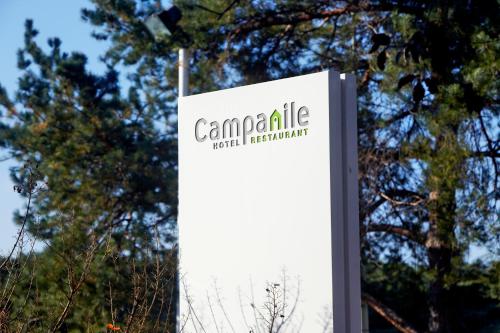 a sign for canadaale realestate in front of some trees at Campanile Villefranche-Sur-Saône in Villefranche-sur-Saône
