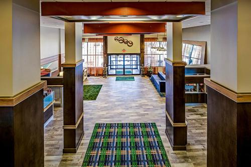 a hallway of a building with a rug at Holiday Inn Cleveland Northeast - Mentor, an IHG Hotel in Mentor
