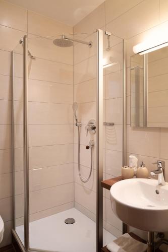 a bathroom with a shower and a sink at Land Wirtschaft Höß in Bad Feilnbach