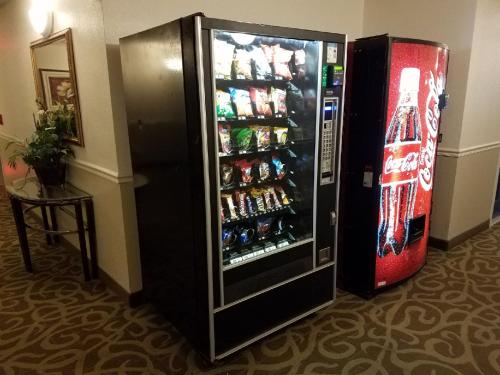 a refrigerator with drinks in it in a room at InTown Suites Extended Stay Colorado Springs in Colorado Springs