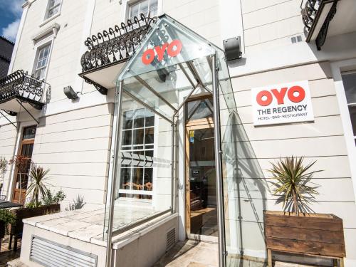 a glass booth in front of a building at OYO the Regency, Clifton Bristol in Bristol