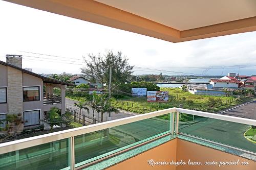 a balcony with a view of a street at Pousada Molhes da Barra in Torres