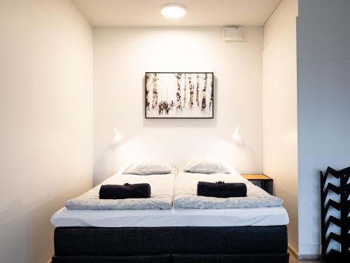 Кровать или кровати в номере First Aparthotel Comet