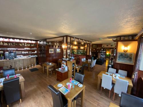 an overhead view of a restaurant with tables and chairs at Kylemore Pass Hotel in Letterfrack