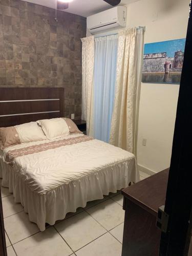 Ein Bett oder Betten in einem Zimmer der Unterkunft Hotel Posada San Juan