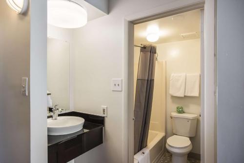 a white bathroom with a sink and a toilet at Motel 6-Somers Point, NJ - Ocean City - Wild Wood Beach in Somers Point