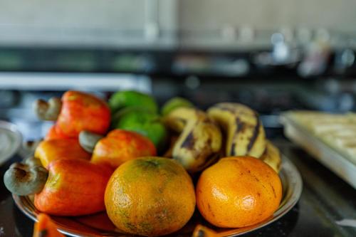 a bowl of fruit sitting on a table at Hotel Meireles in Fortaleza
