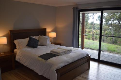 Postel nebo postele na pokoji v ubytování Eagle Bay House