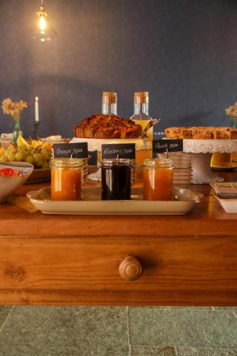 a table with food and drinks on top of it at Agriturismo Treterre in Pianello Del Lario