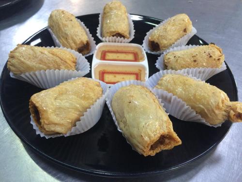 a plate of food with pastries on a plate at LayTrang Pakmeng Marina Spa and Resort in Trang