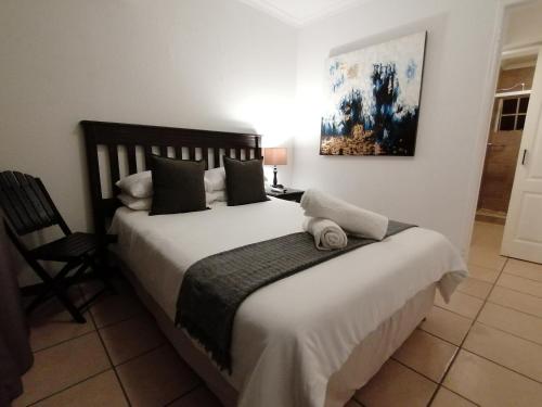 Ένα ή περισσότερα κρεβάτια σε δωμάτιο στο Fourways BnB