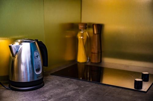 a toaster sitting on a counter in a kitchen at Liepaja Apartments in Liepāja