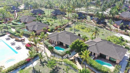 an aerial view of a resort with a swimming pool at The Sands Beach Resort in Bwejuu