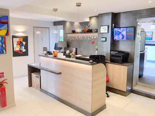 a kitchen with a counter top in a room at Hotel Miramar- Cap d'Antibes - La Garoupe plage in Antibes
