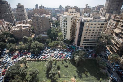 an aerial view of a parking lot in a city at Aura Inn Hotel Cairo in Cairo