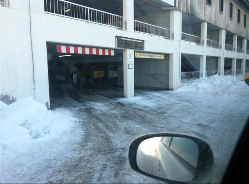 a side view mirror of a car in front of a building at Sonnleitn 29 in Sonnenalpe Nassfeld