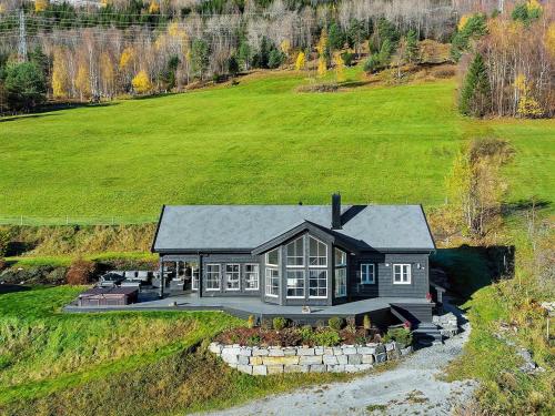 an aerial view of a house on a hill at 8 person holiday home in Valldal in Valldal