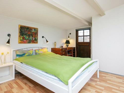 Voodi või voodid majutusasutuse Three-Bedroom Holiday home in Frørup 3 toas