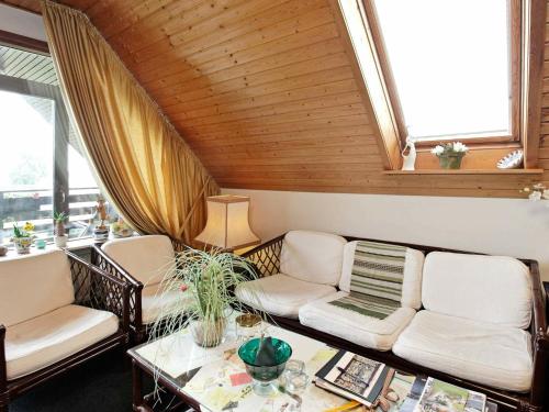 a living room with two couches and a table at 2 person holiday home in Svendborg in Svendborg