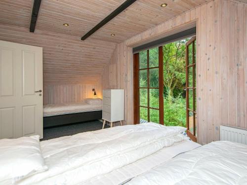 Cama ou camas em um quarto em Holiday home Nimtofte