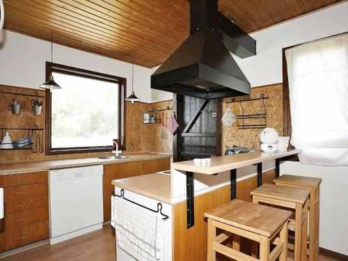 a kitchen with a sink and a stove at 6 person holiday home in Thisted in Klitmøller