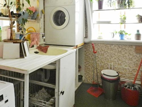 a kitchen with a washing machine and a sink at Holiday Home Västra IV in Lysekil