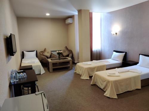 Postel nebo postele na pokoji v ubytování Richmind Hotel