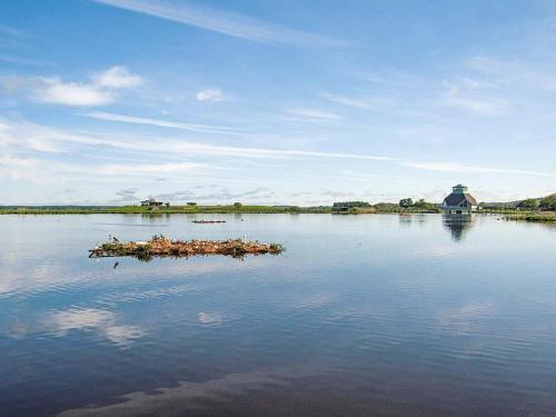 a small island in the middle of a lake at 6 person holiday home in VARA in Vara