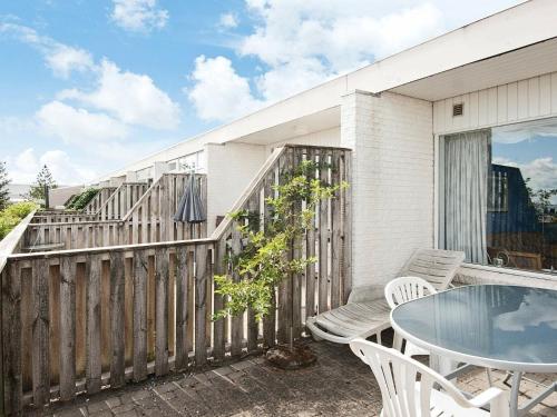 A balcony or terrace at 4 person holiday home in R m