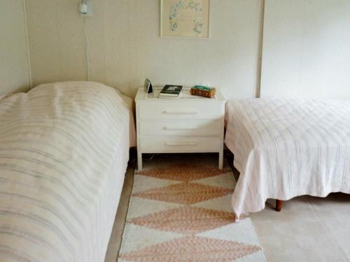 En eller flere senger på et rom på Holiday home BORÅS
